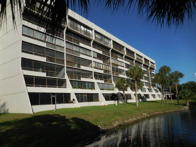 a view of building with yard