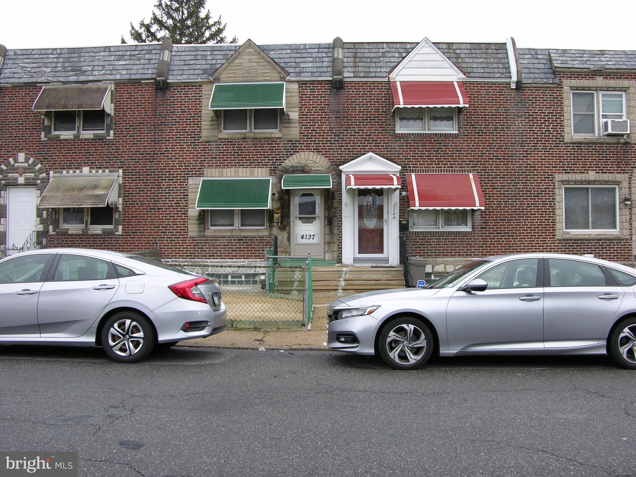 a car parked in front of a house