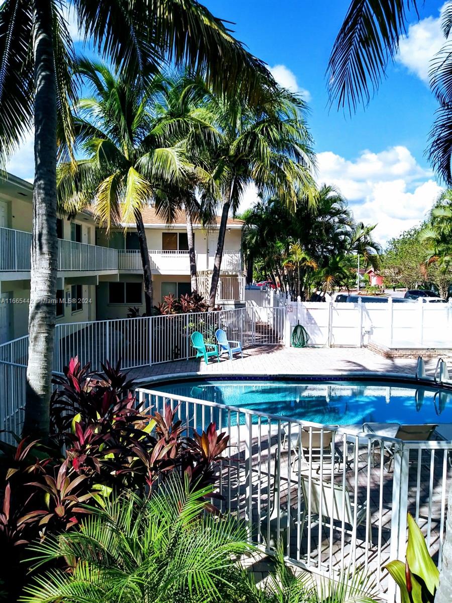 a view of a swimming pool with a patio