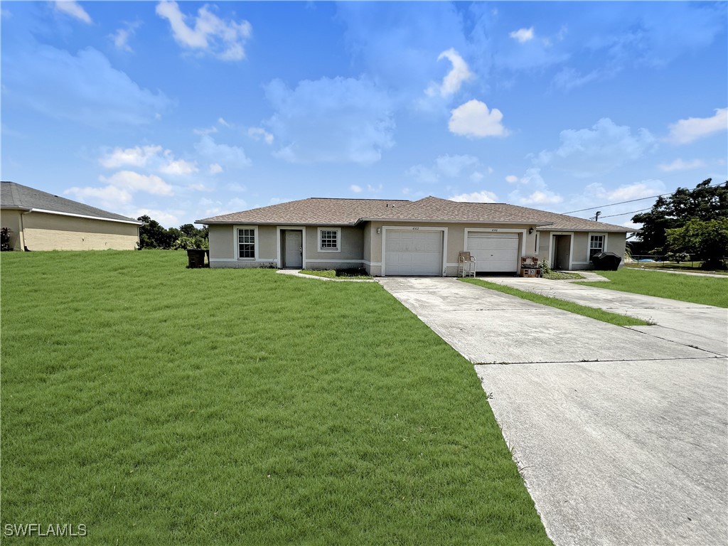 a view of a house with a big yard