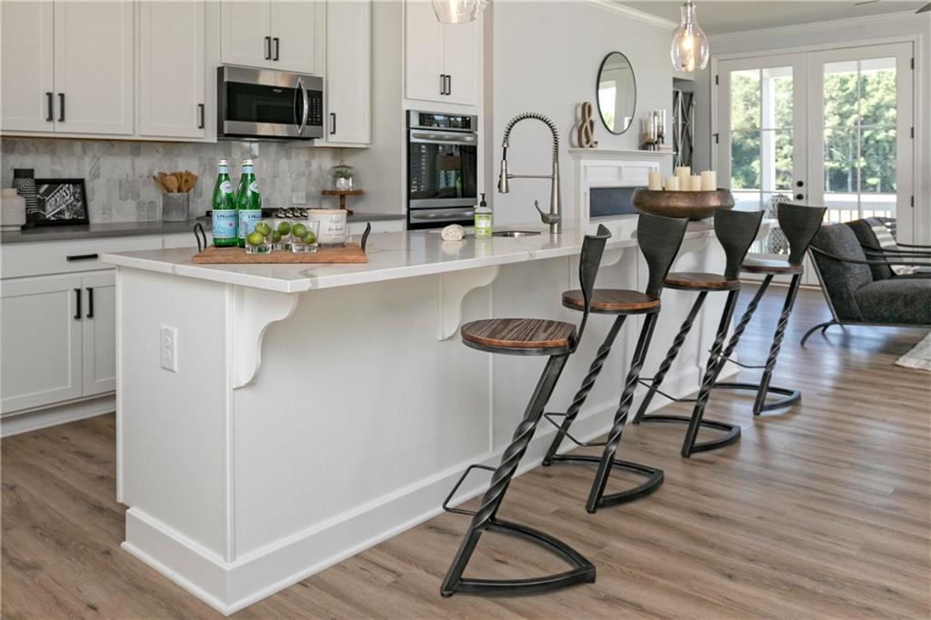 a view of a kitchen with dining table and workspace