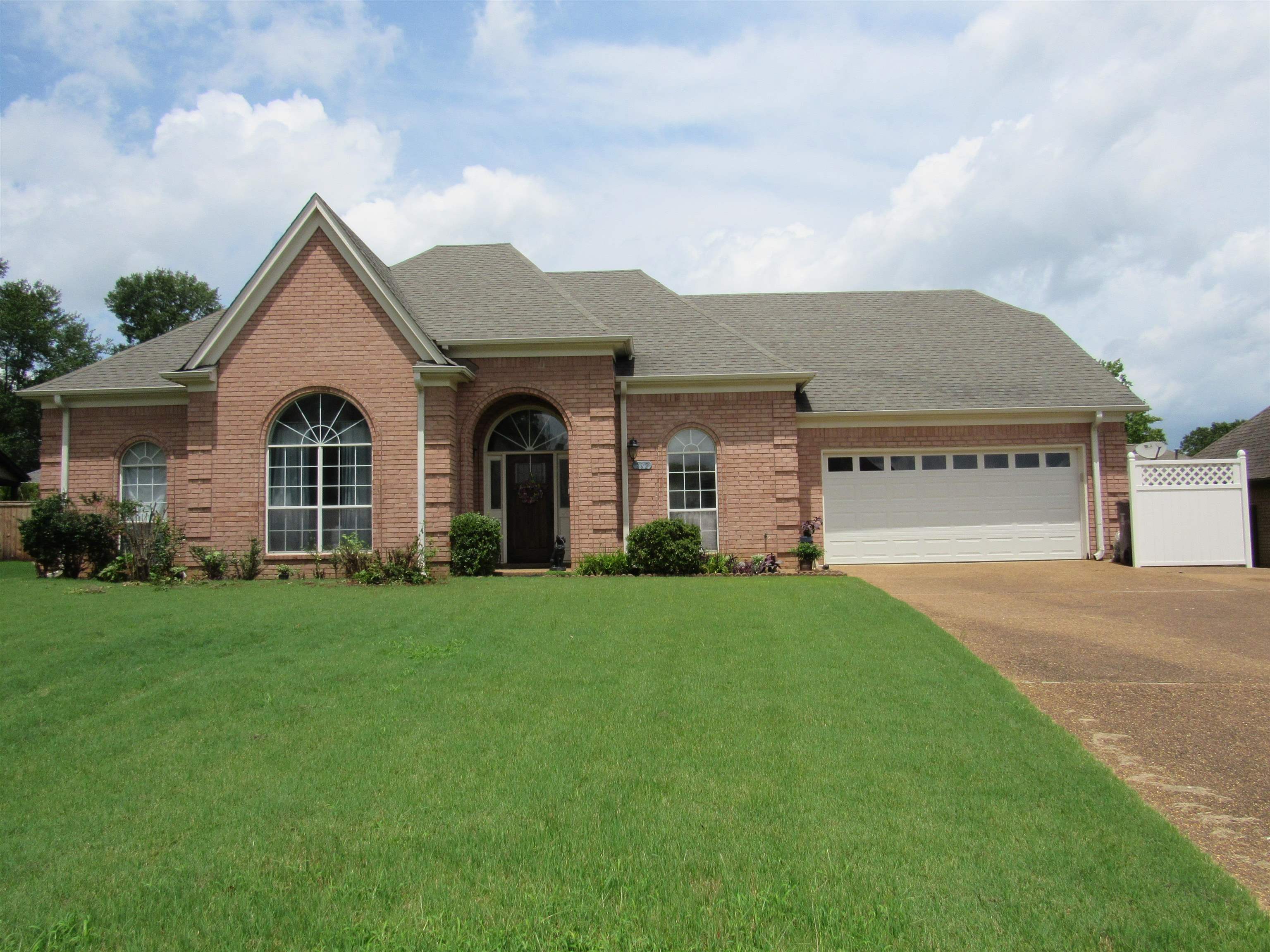 front view of a house with a yard