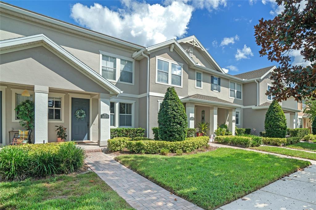 a front view of a house with a yard