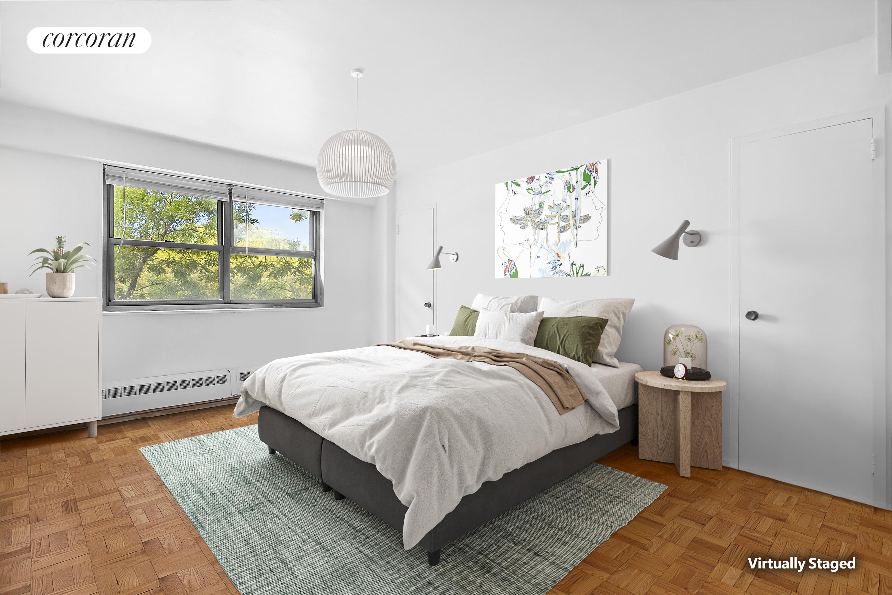 a spacious bedroom with a bed and wooden floor