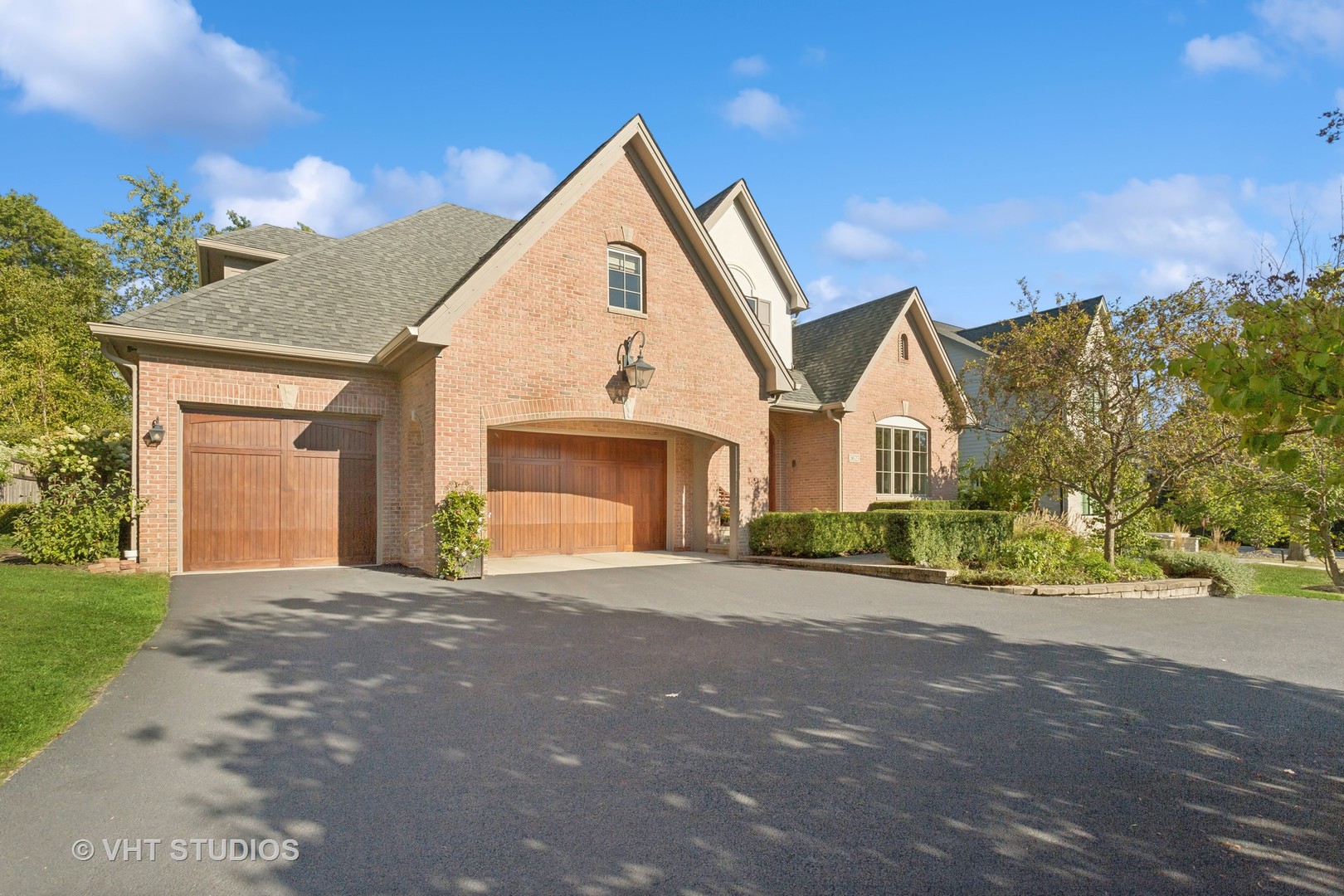 a view of a house with a yard and garage