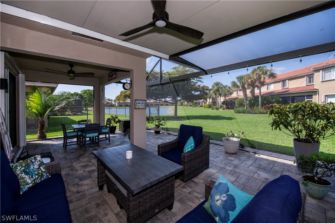 a view of a patio with a dining table and chairs