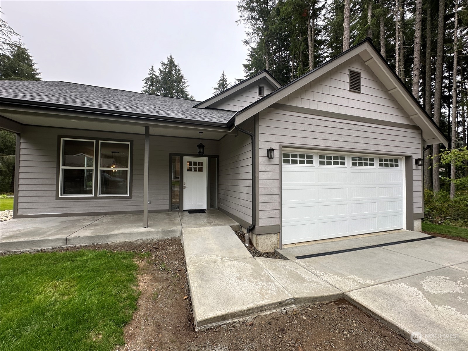 a front view of a house with a garage