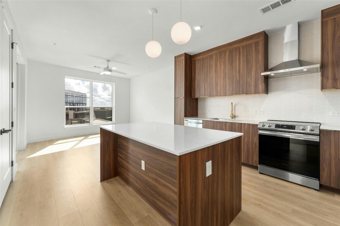 a kitchen with a stove and a sink