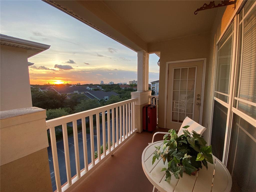 a view of balcony with furniture