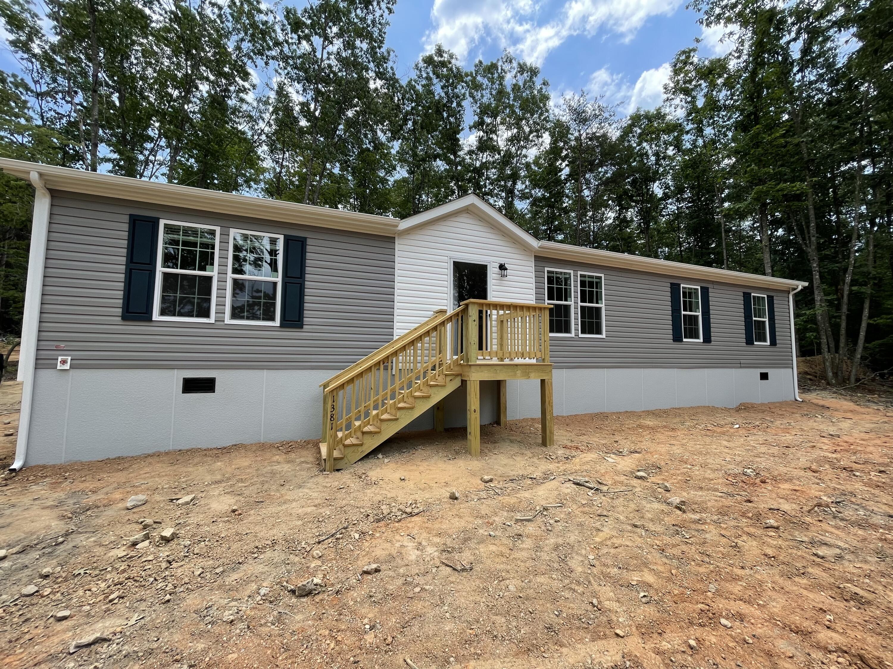 a house with trees in the background