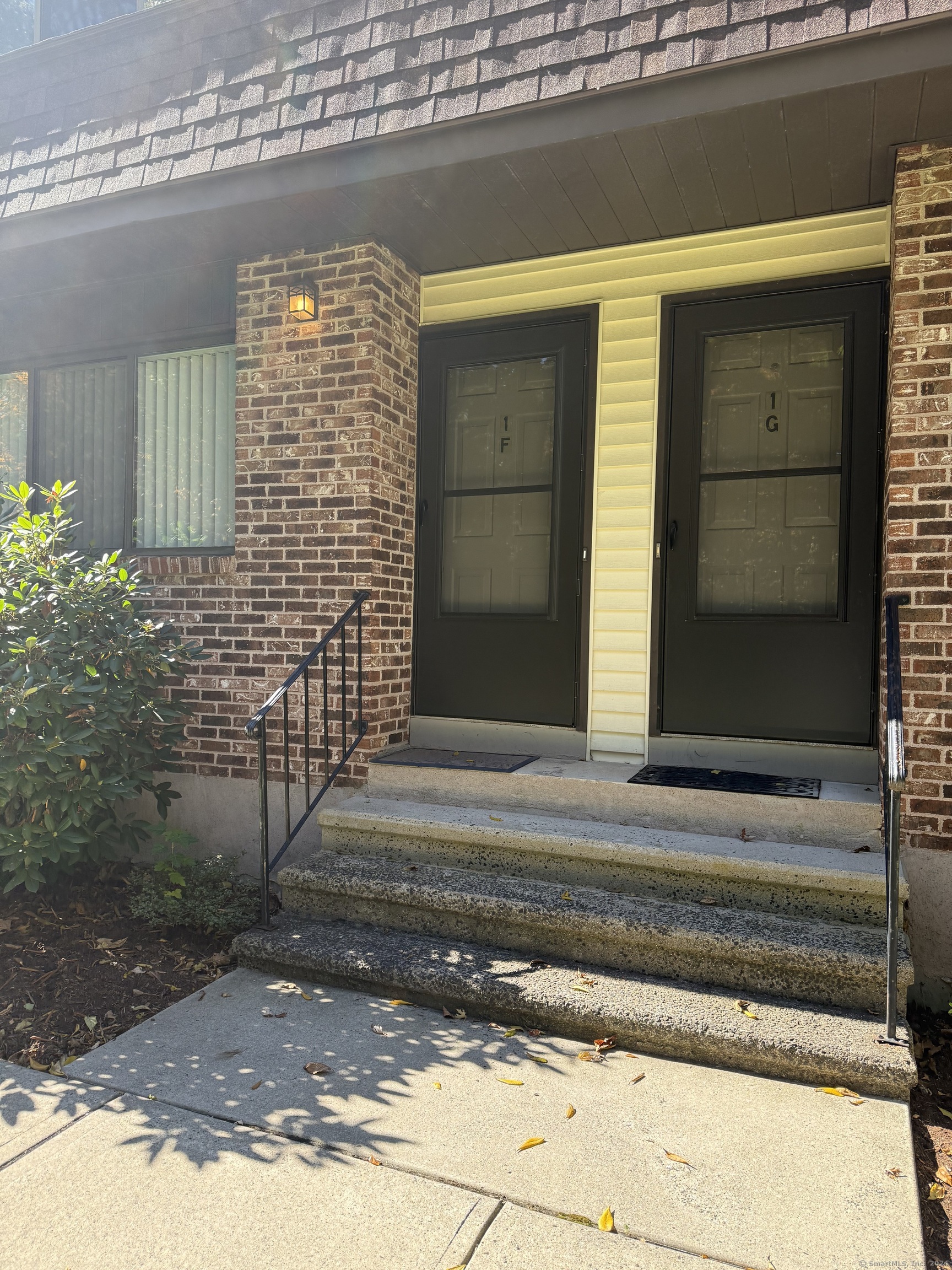 a view of a house with a door and wooden floor