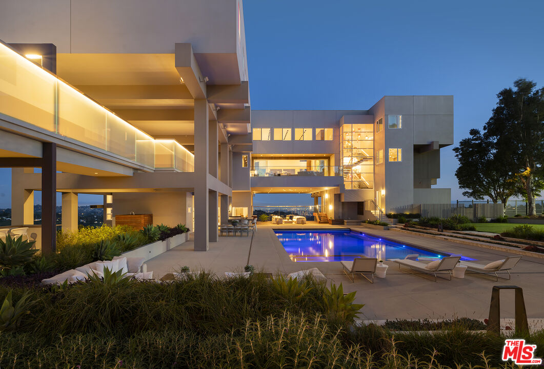 a view of a swimming pool with a patio