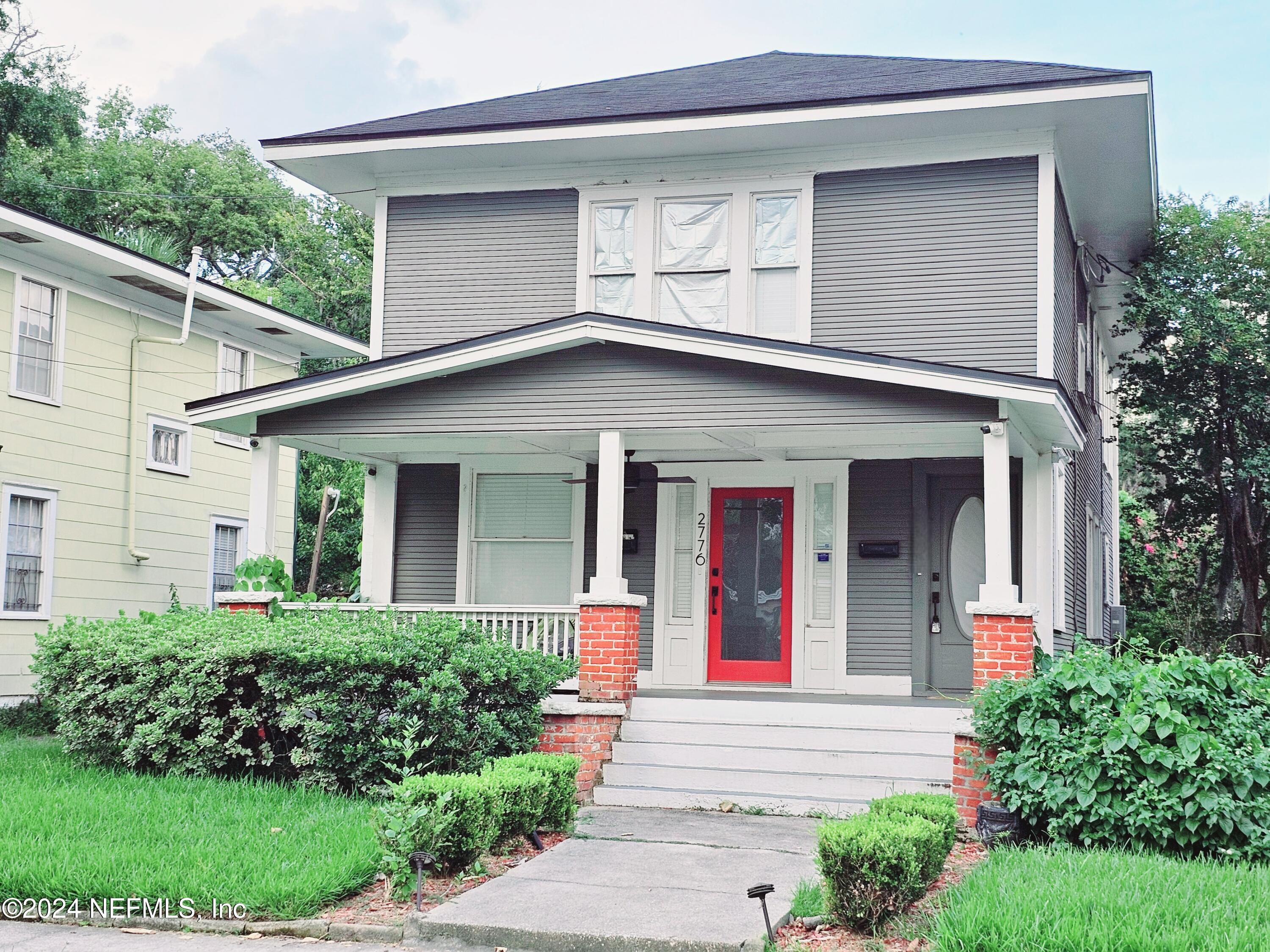 front view of a house with a small yard