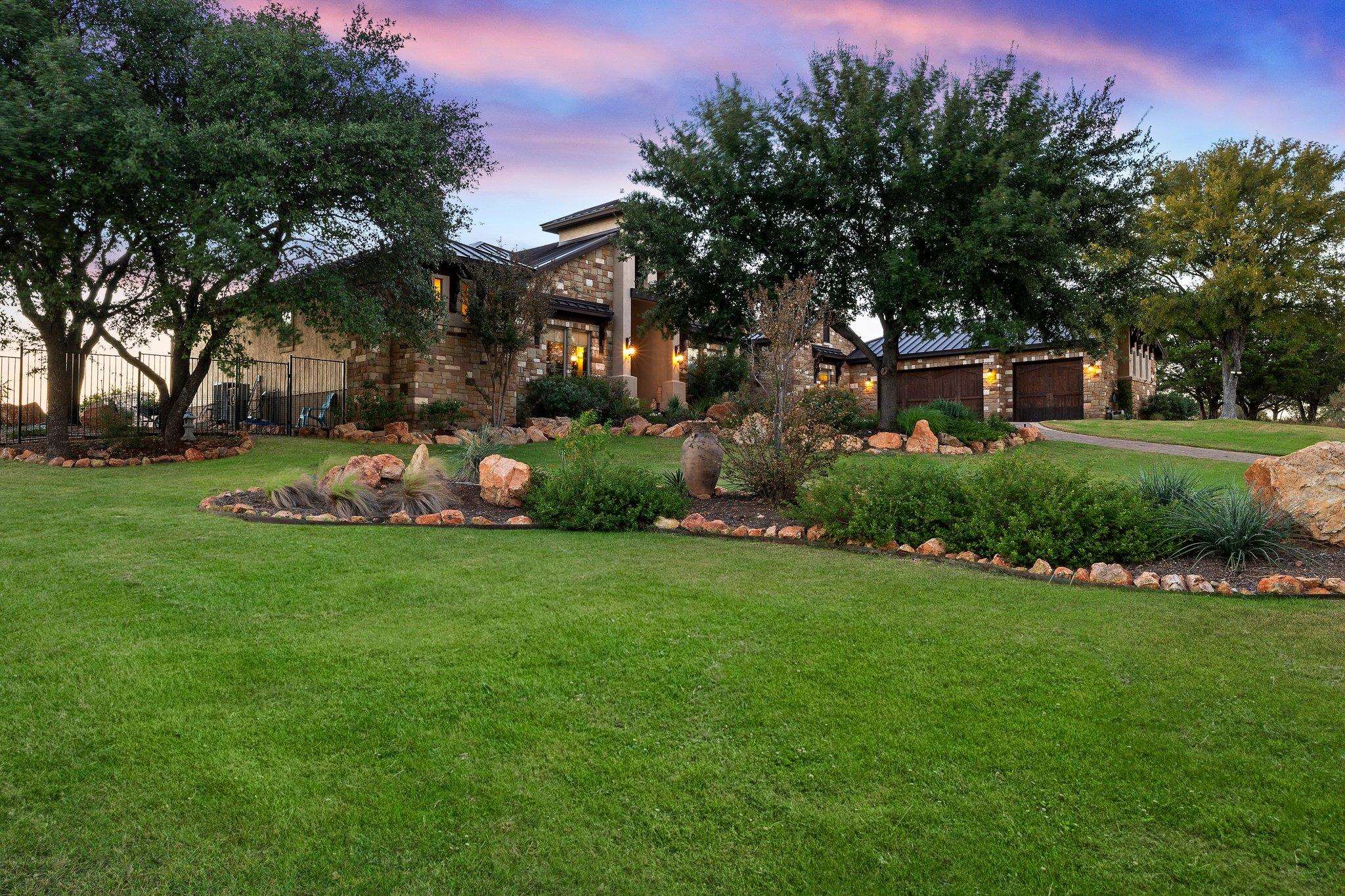 a front view of a house with garden