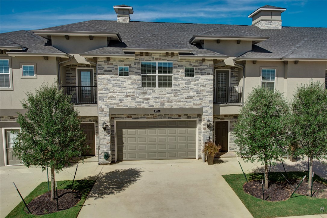 View of front of property featuring a garage