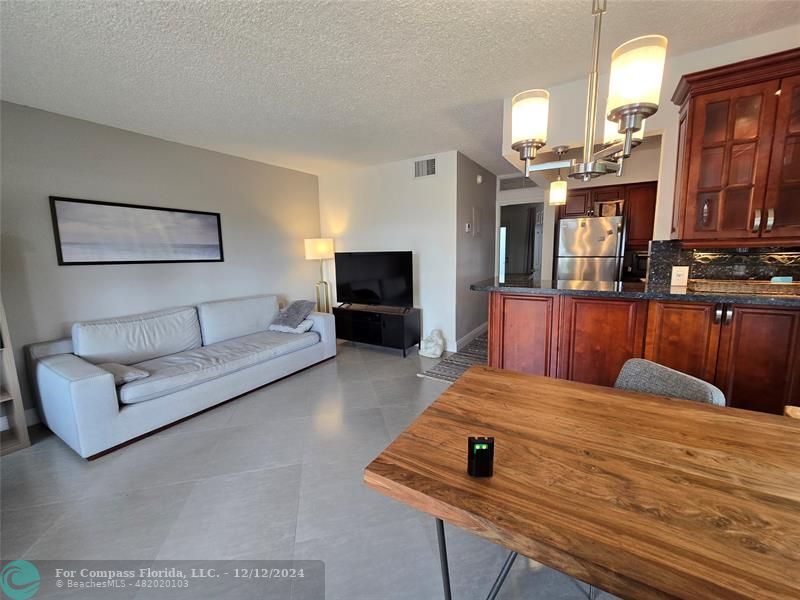 a bedroom with a bed window and couch