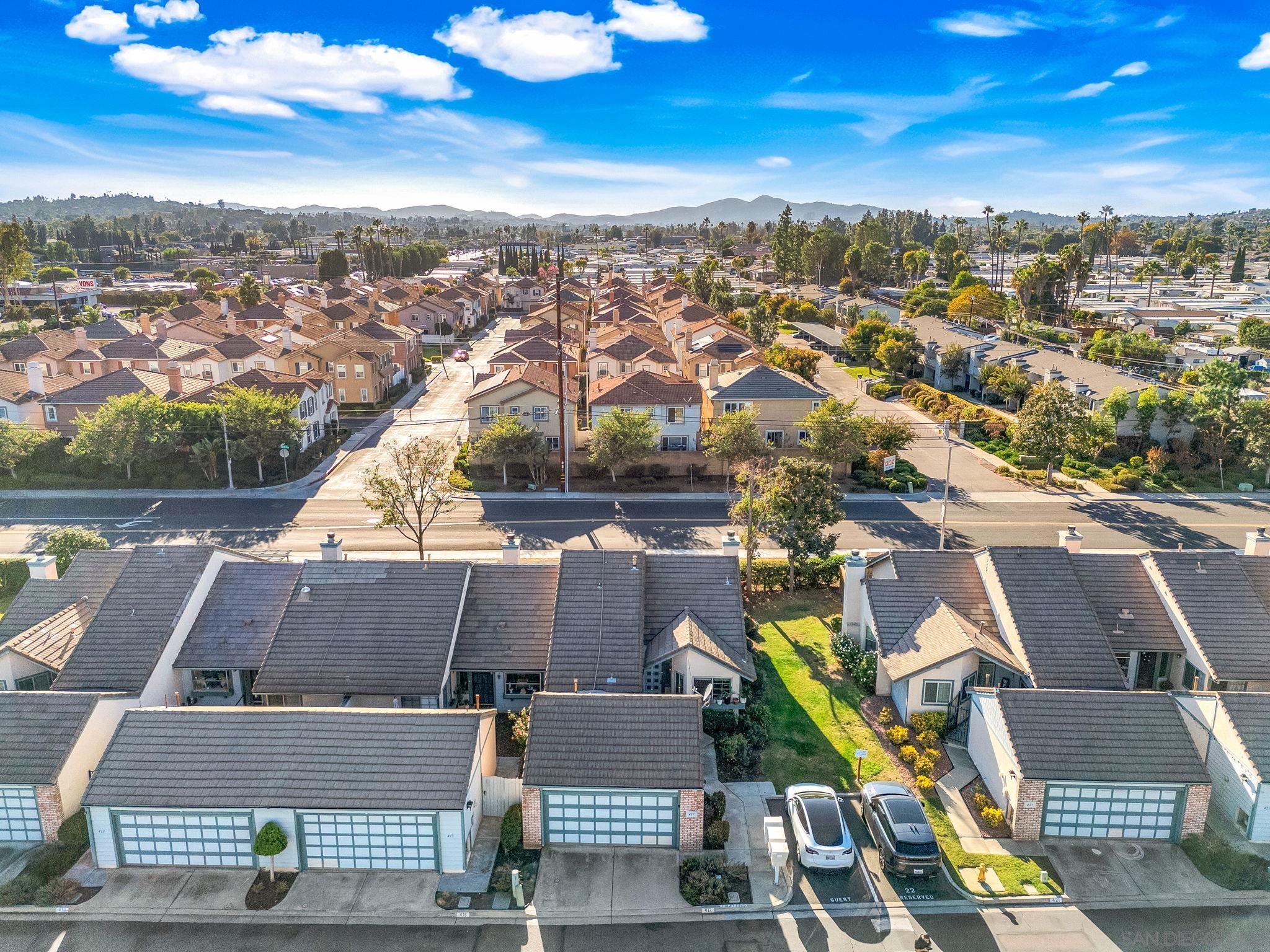 an aerial view of residential houses with outdoor space