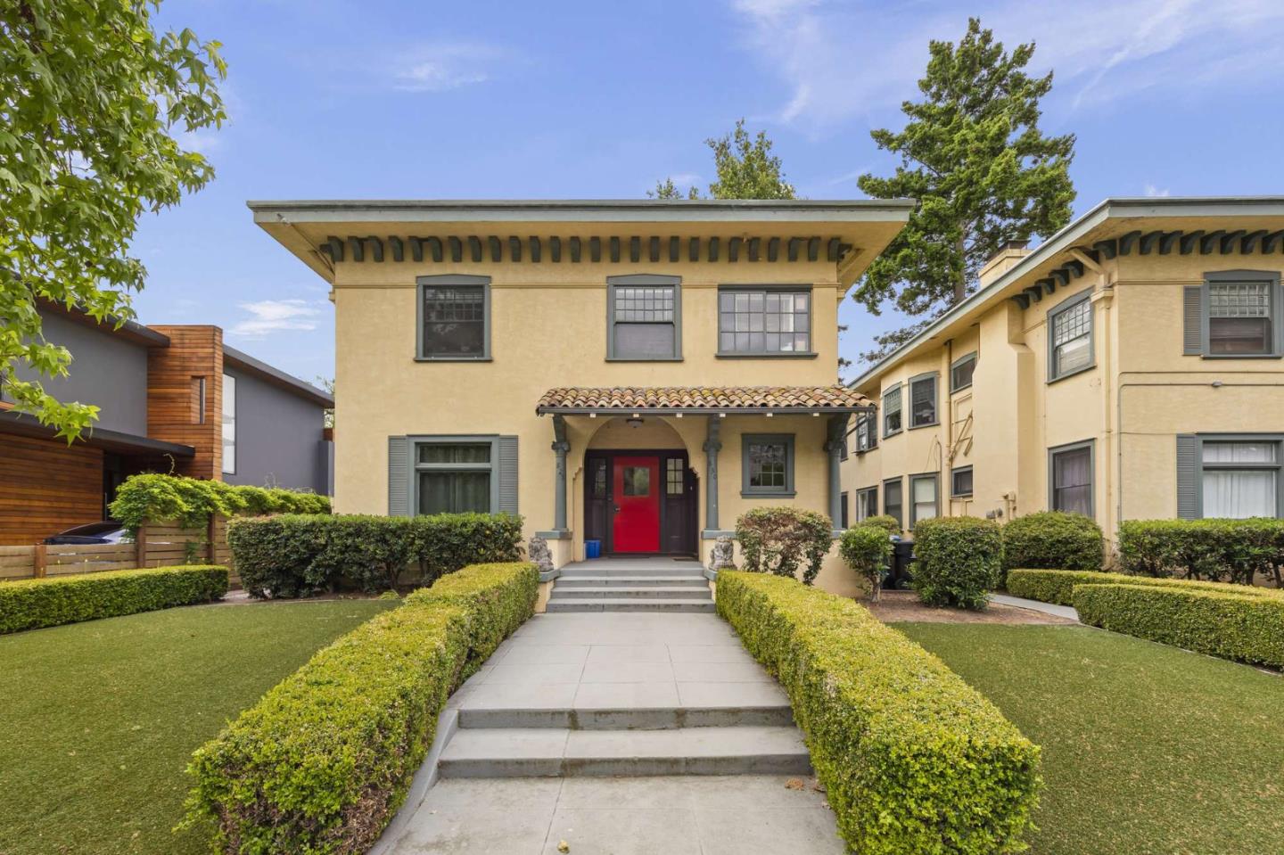 a front view of house with yard and green space