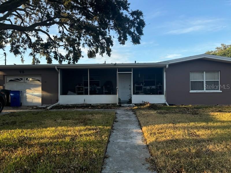 a view of a house with a yard