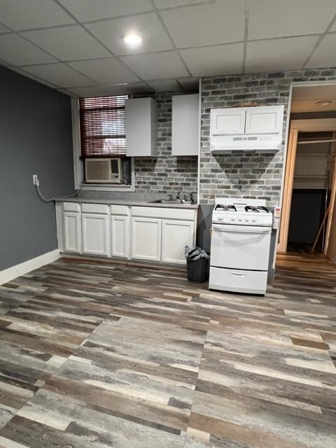 a kitchen with stainless steel appliances granite countertop a sink and a stove