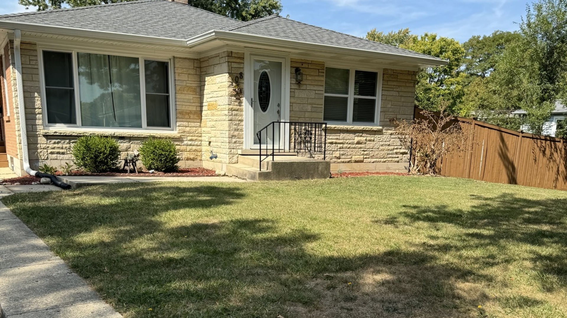 front view of a house with a yard