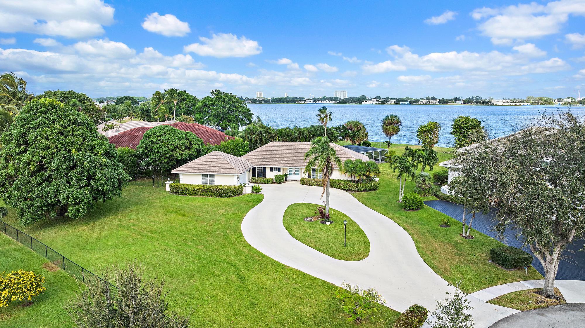 a view of a lake with a yard