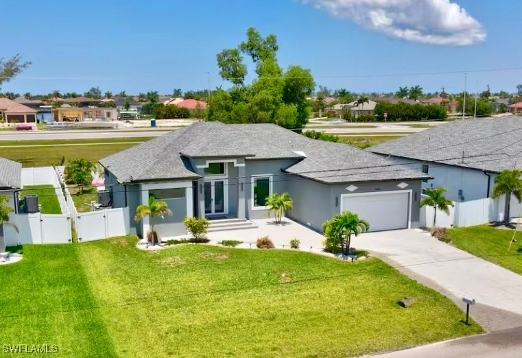 a view of a house with a swimming pool and a chairs