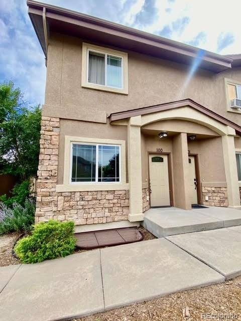 a front view of a house with garage