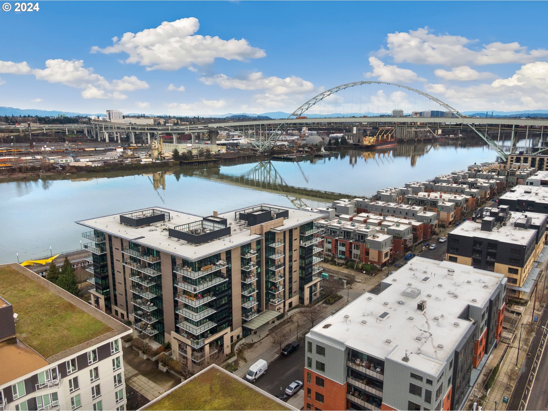 a view of a lake with building in front of it