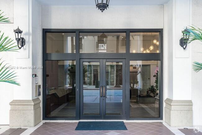 a bathroom with a glass shower door