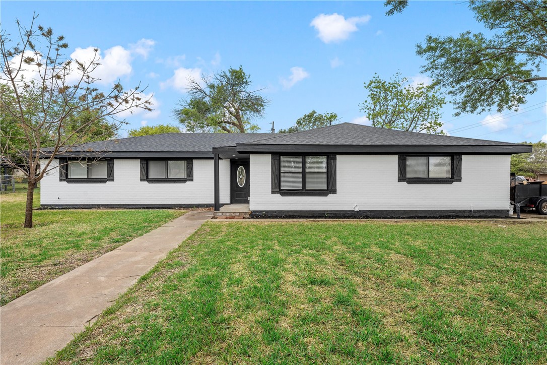 front view of a house with a yard