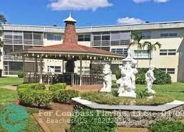 front view of a building with a fountain