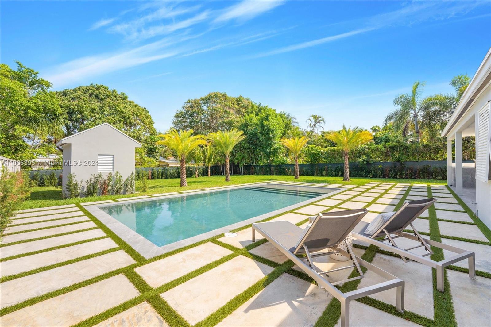 a view of swimming pool with lounge chair