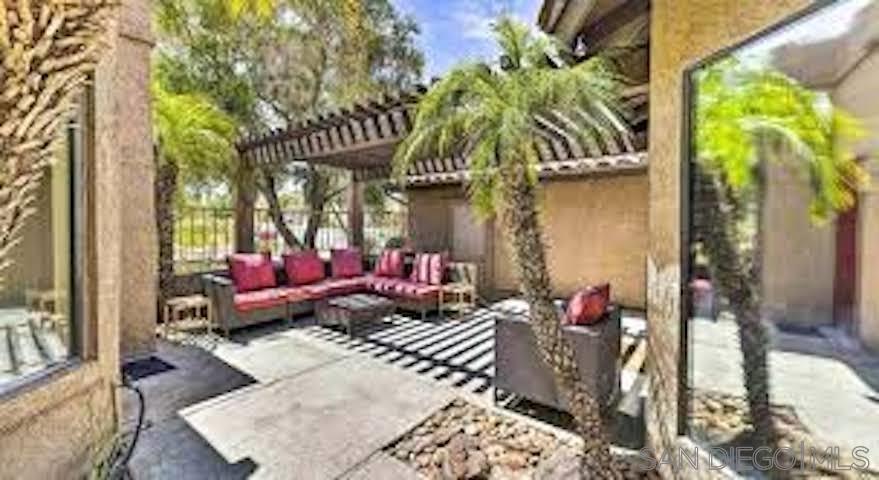 a view of a chairs and tables in the patio