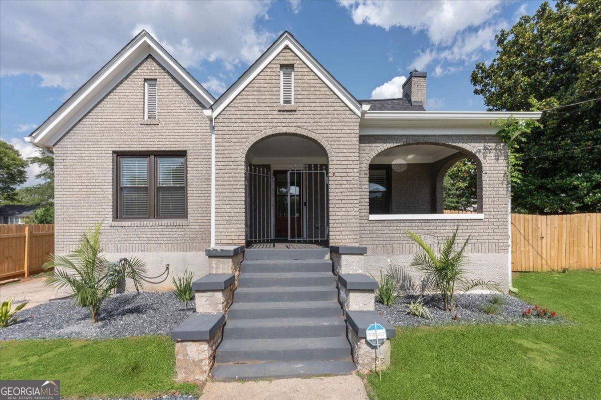 a front view of a house with garden