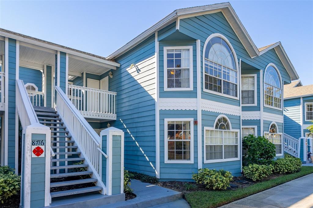 a front view of a house with wooden stairs