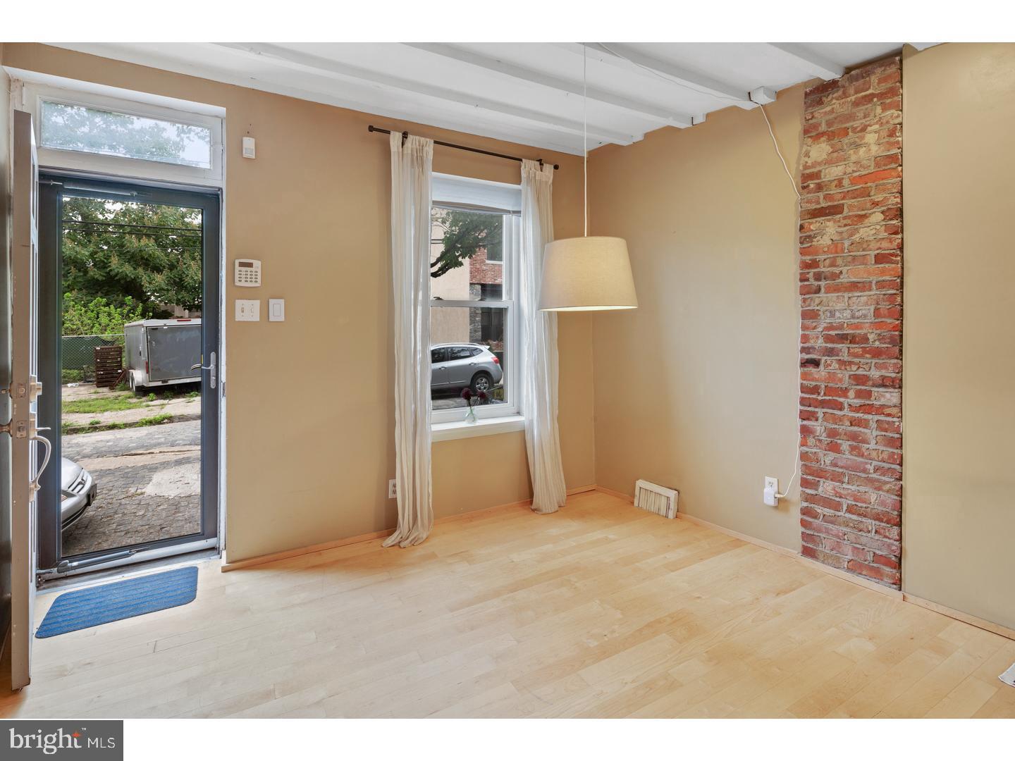 a view of empty room with floor to ceiling window