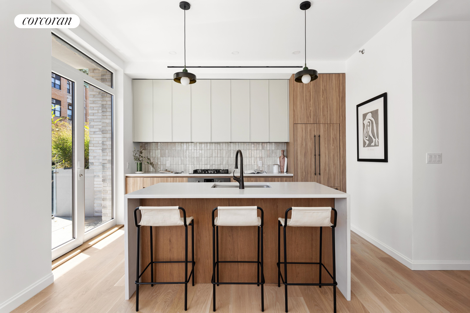 a kitchen with a table and chairs