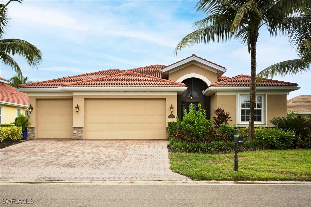 front view of a house with a garden