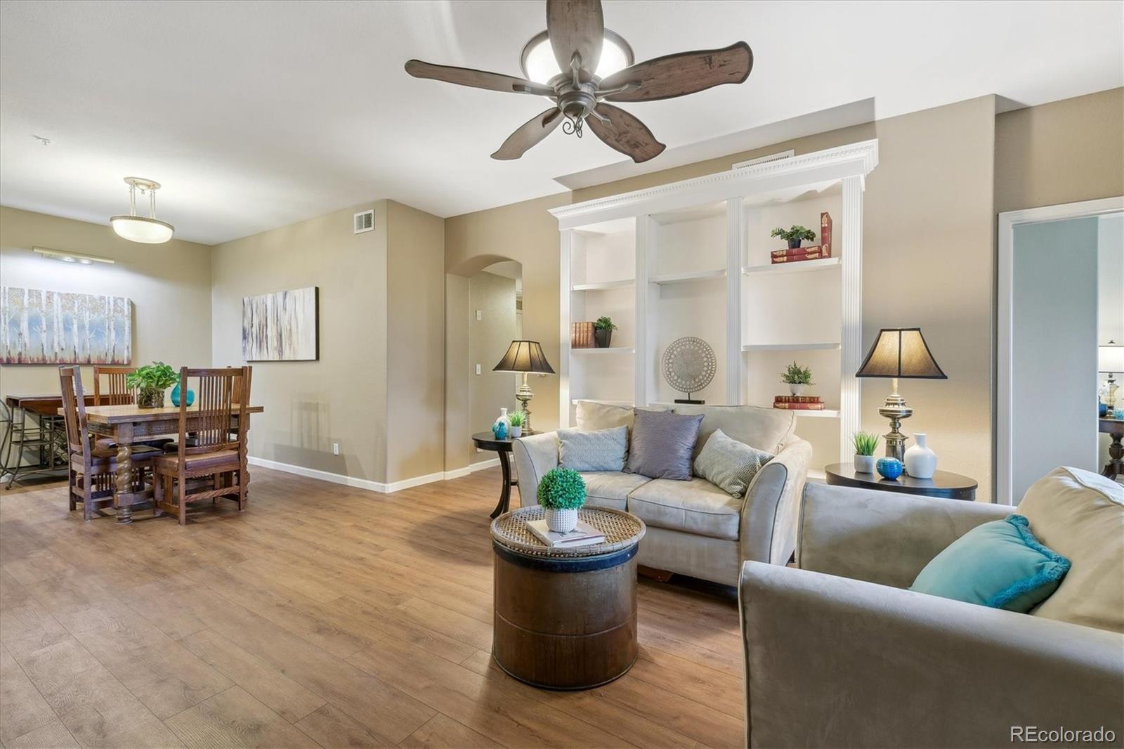 a living room with furniture and white walls