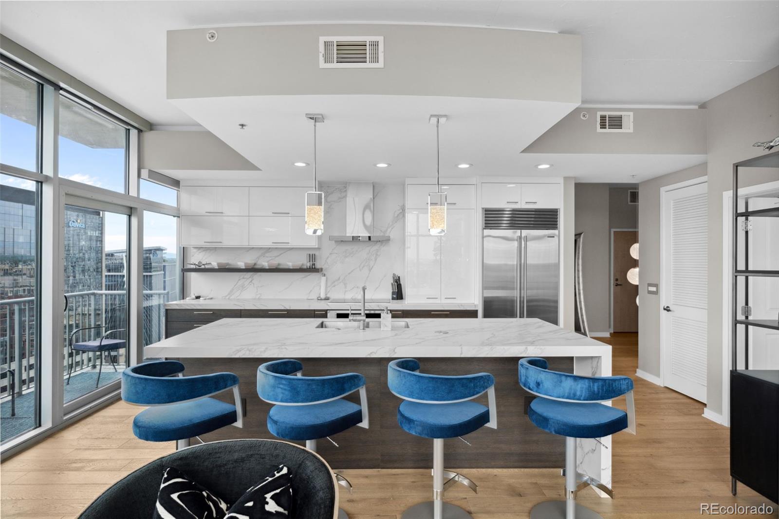 a large kitchen with a table and chairs