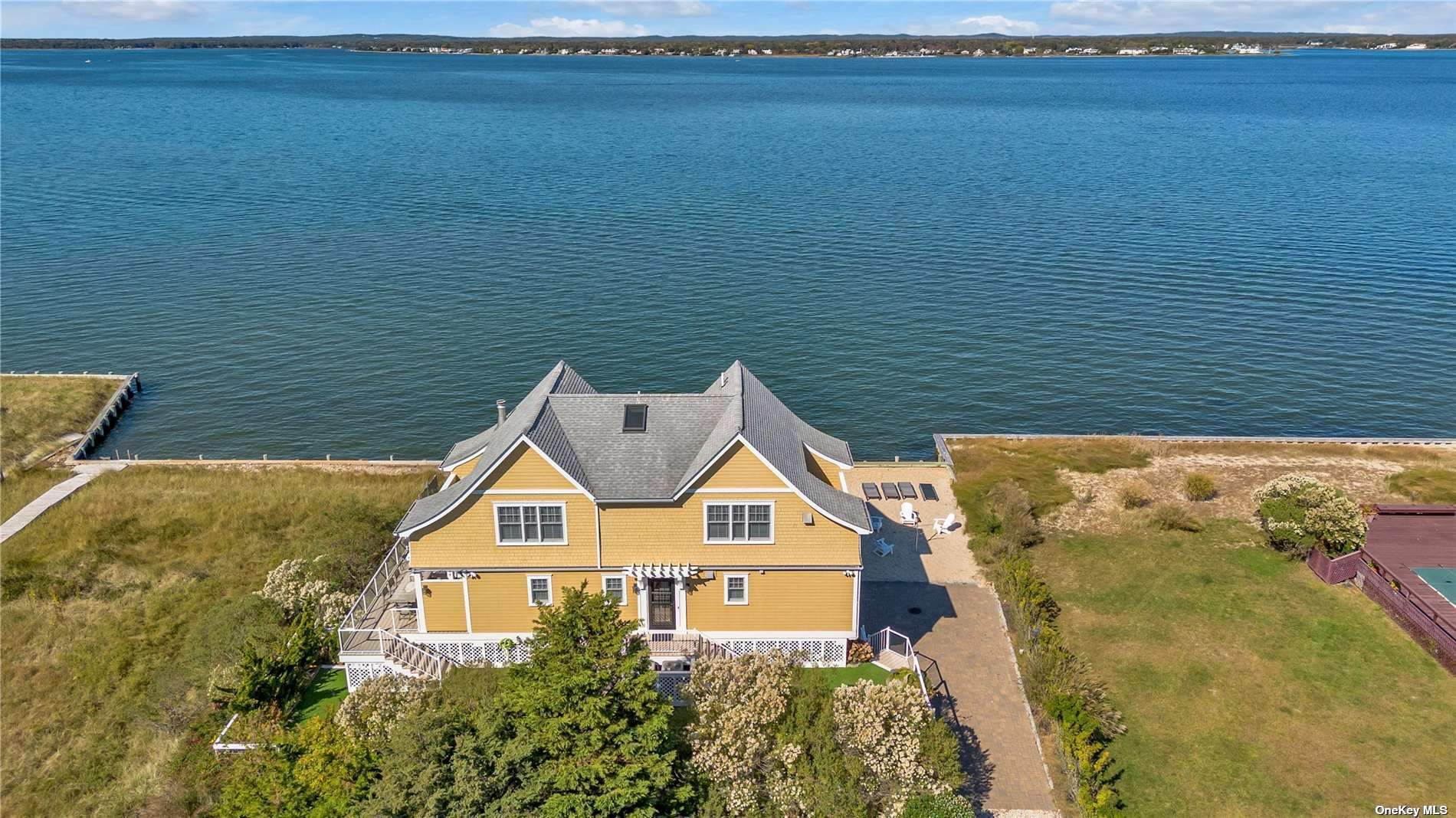 a front view of a house with a lake view