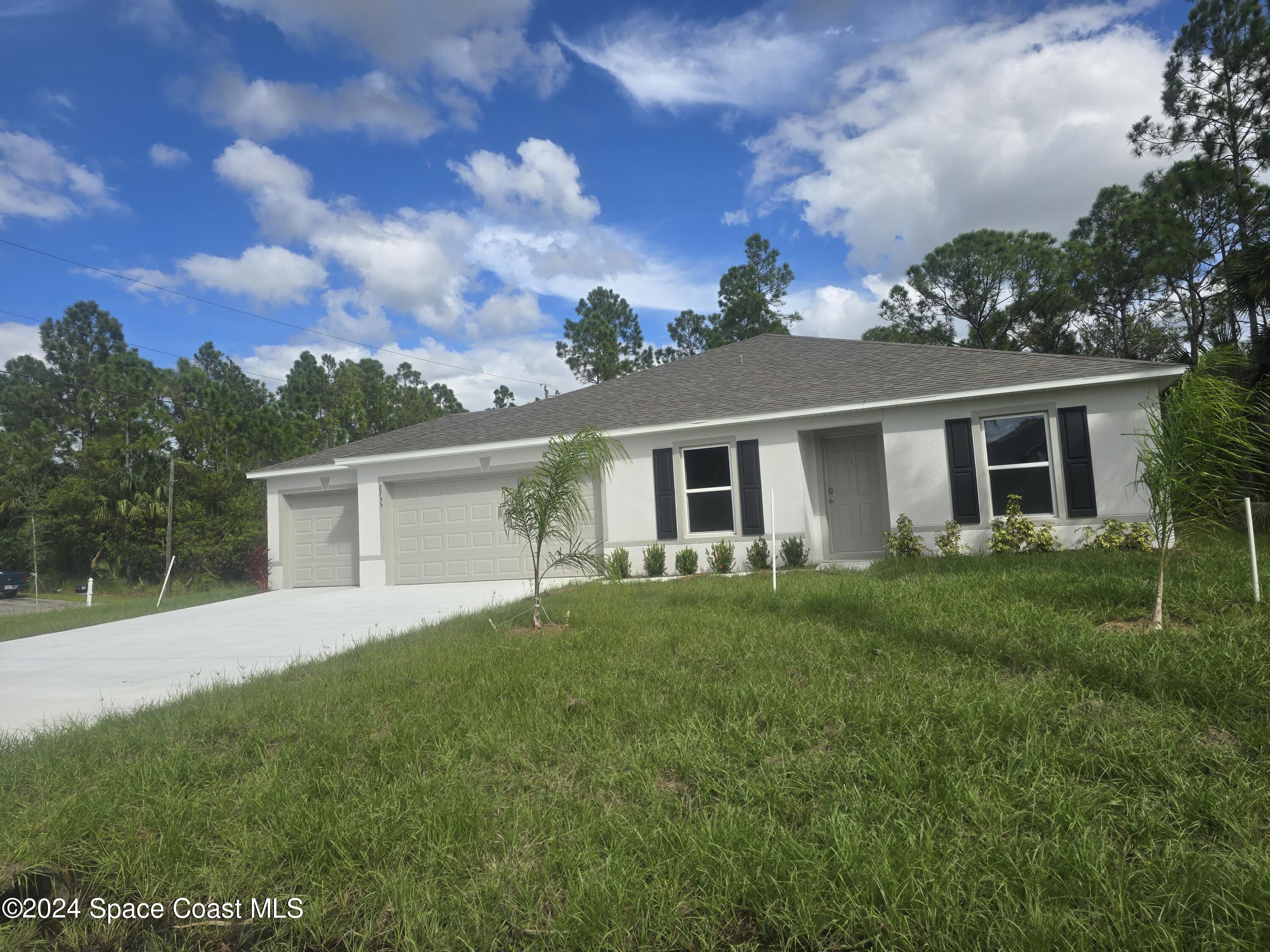 front view of a house with a yard