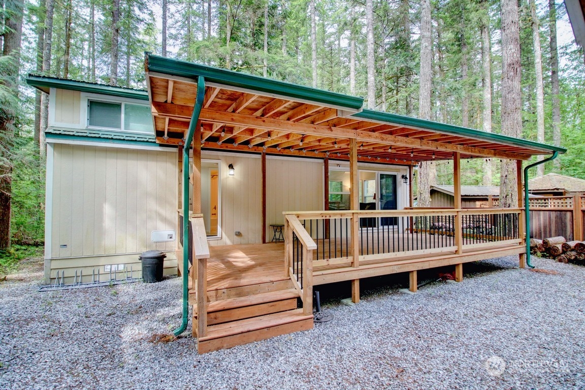 a view of outdoor space and deck having patio