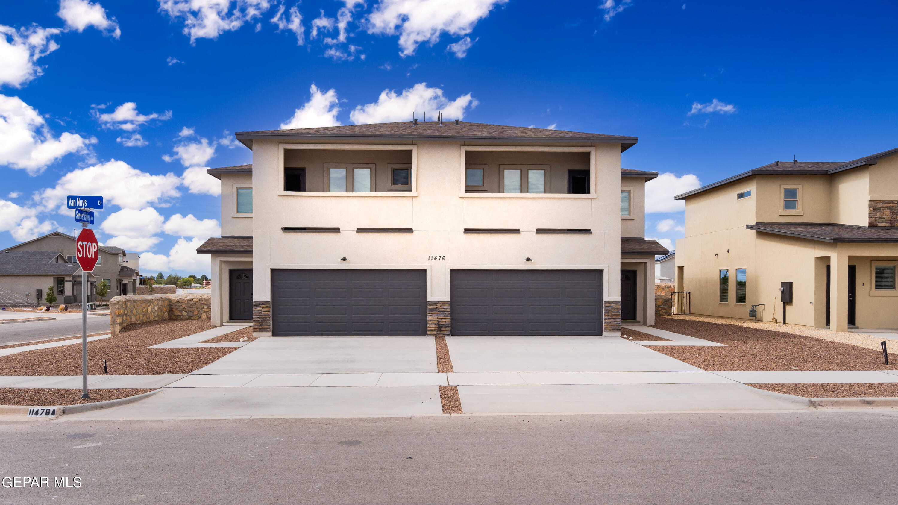 a front view of a house with a garage