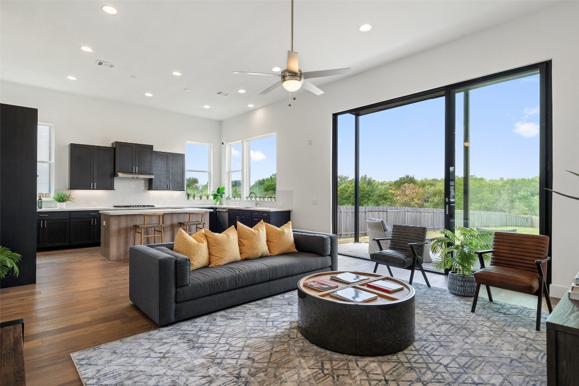 a living room with furniture and a large window