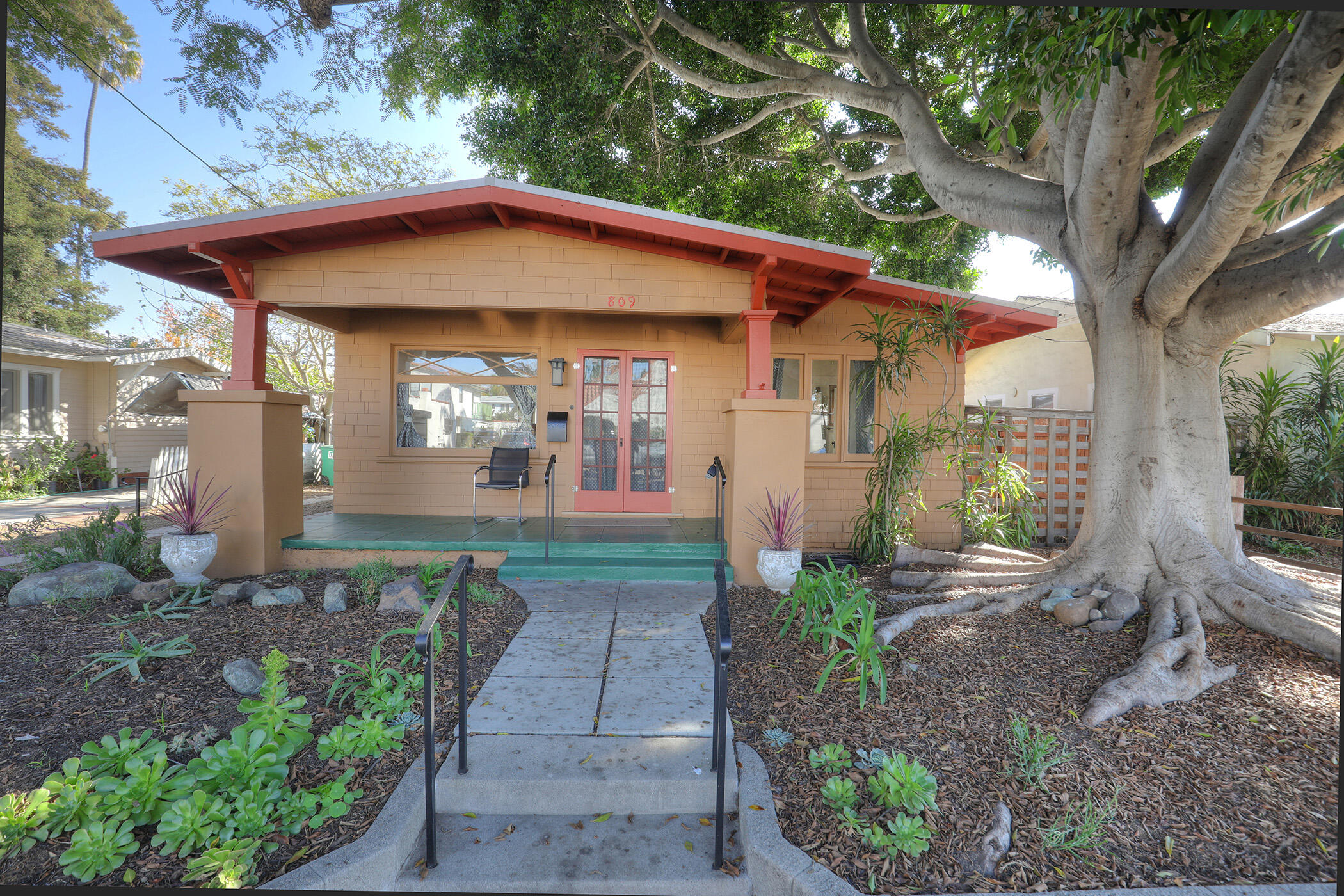 a front view of a house with garden