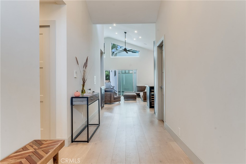 an entryway and livingroom with furniture