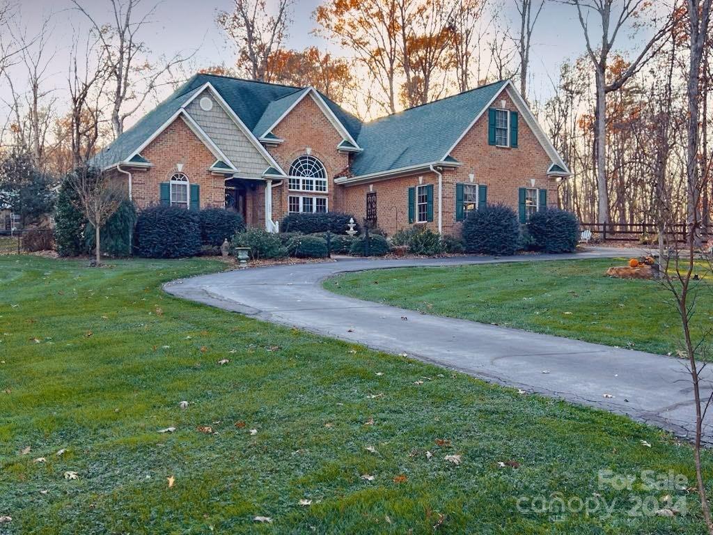 a front view of a house with yard