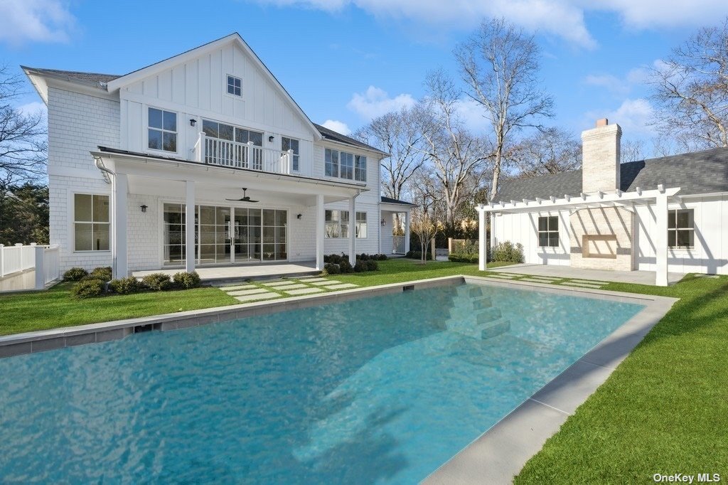 a view of house with a swimming pool